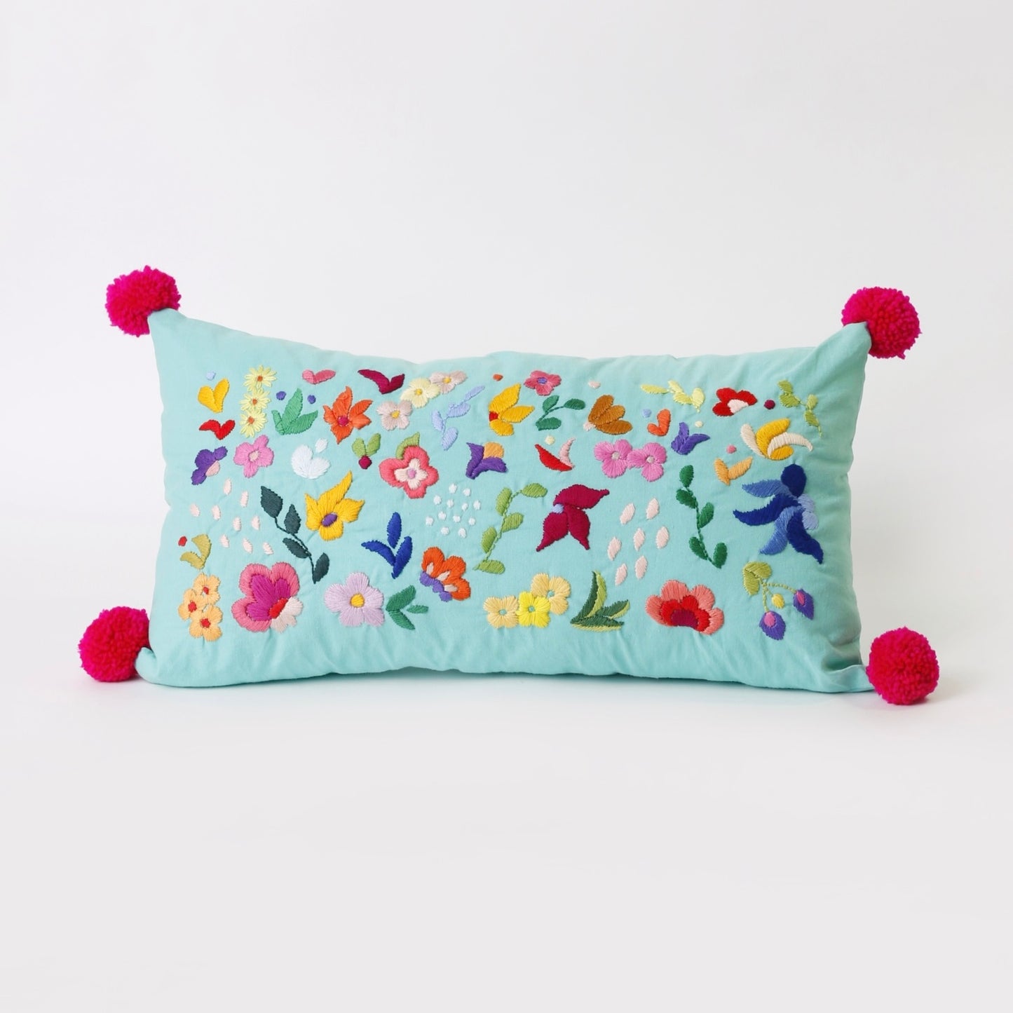 Turquoise hand embroidered cushion