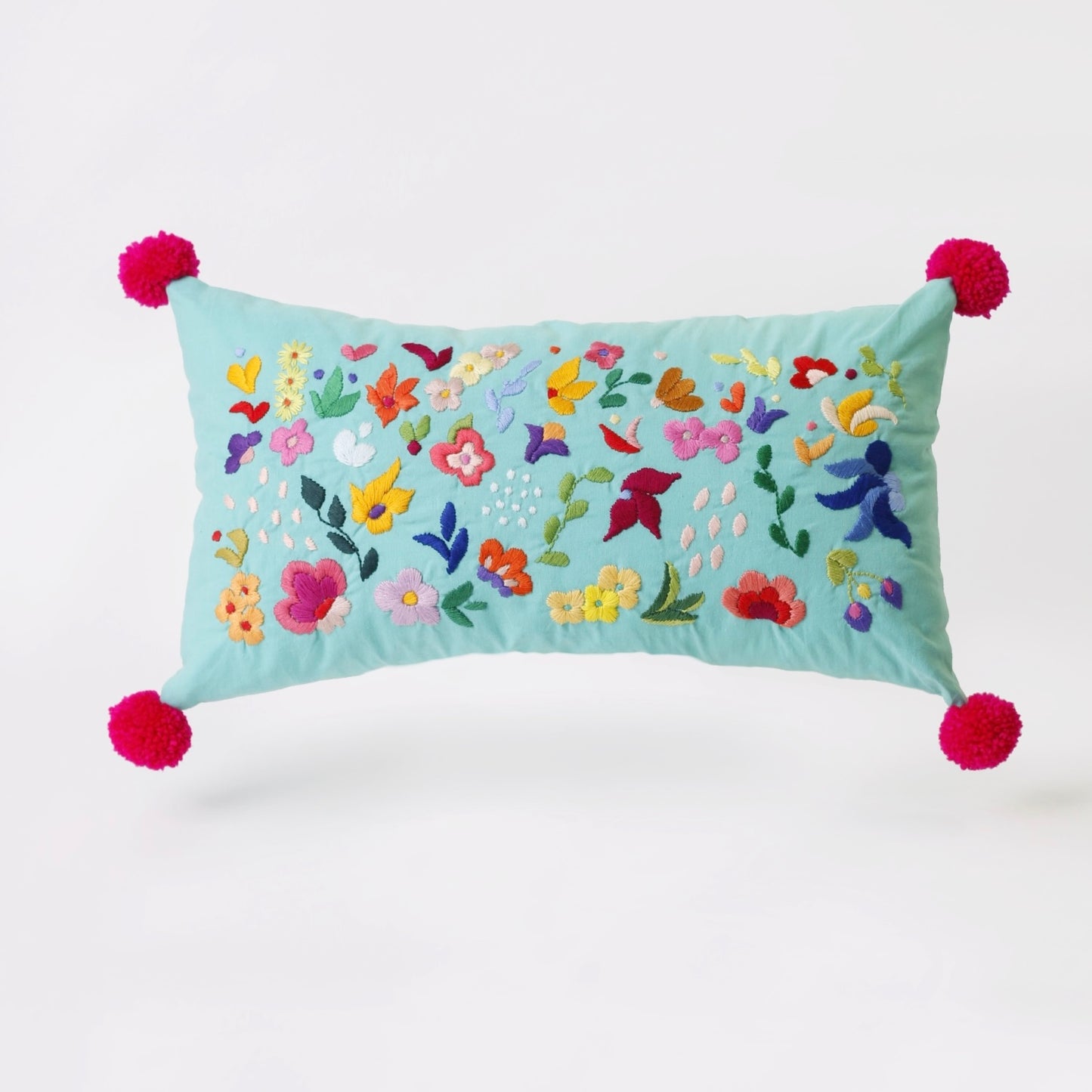 Turquoise hand embroidered cushion