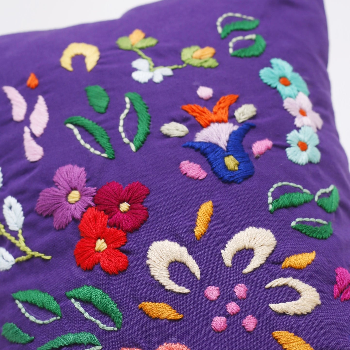 Violet hand embroidered cushion