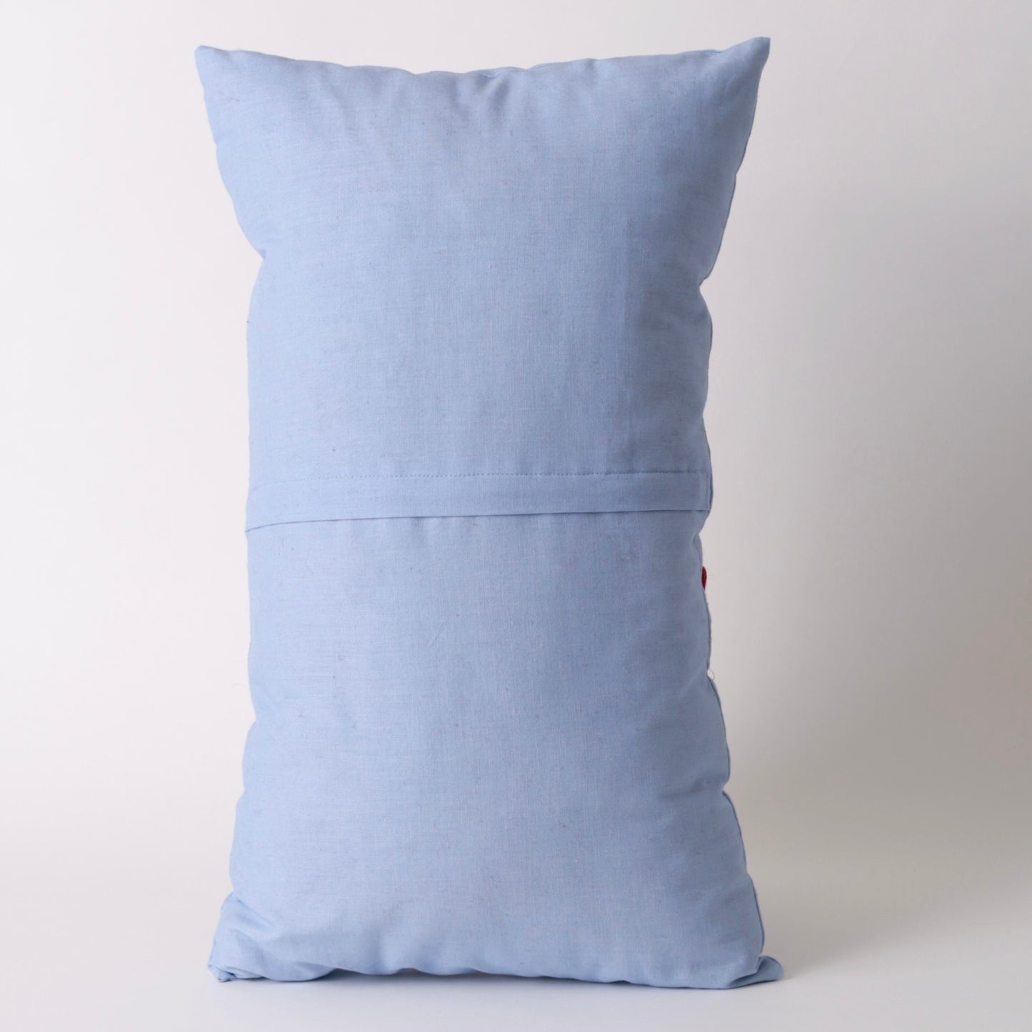 Light blue hand embroidered cushion