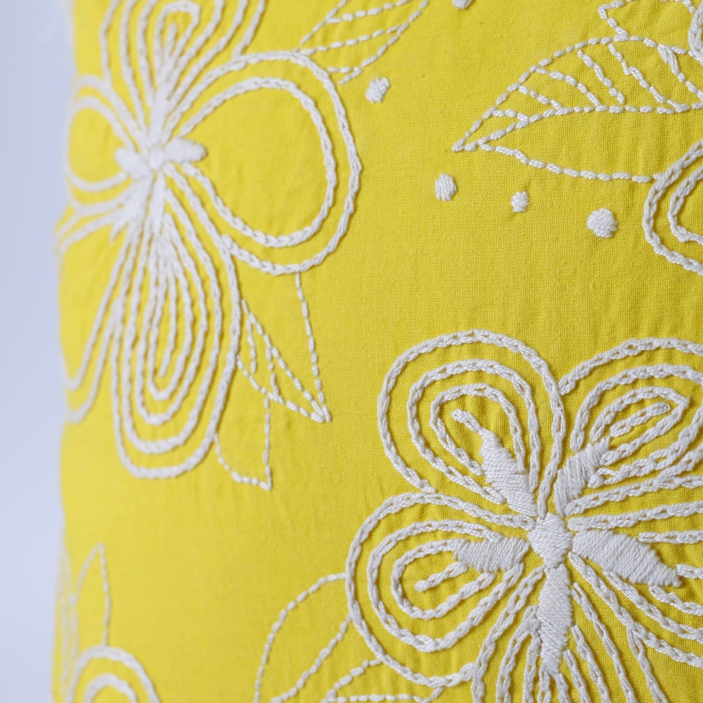 Yellow hand embroidered cushion