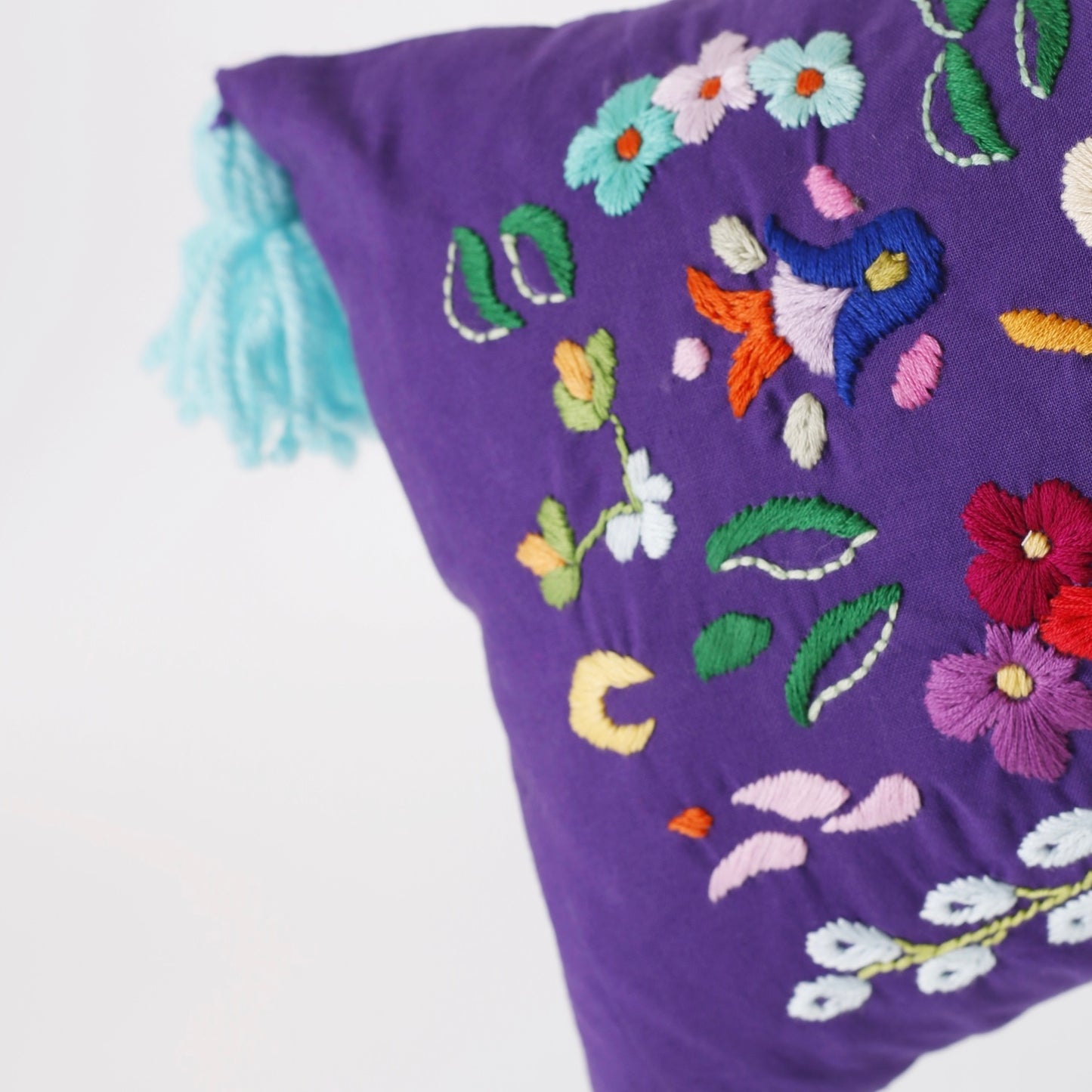 Violet hand embroidered cushion