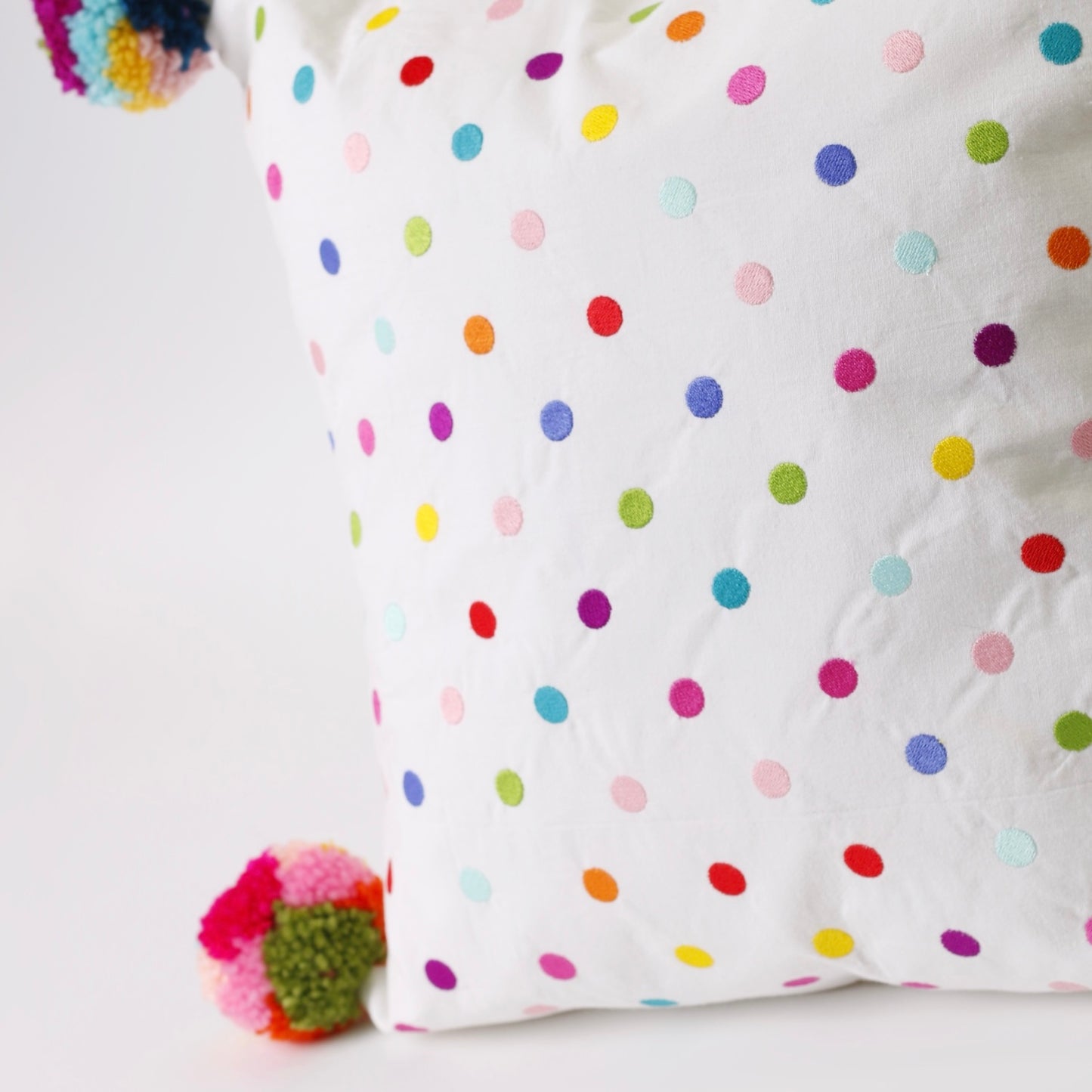 White Embroidered rectangle cotton cushion with pompons