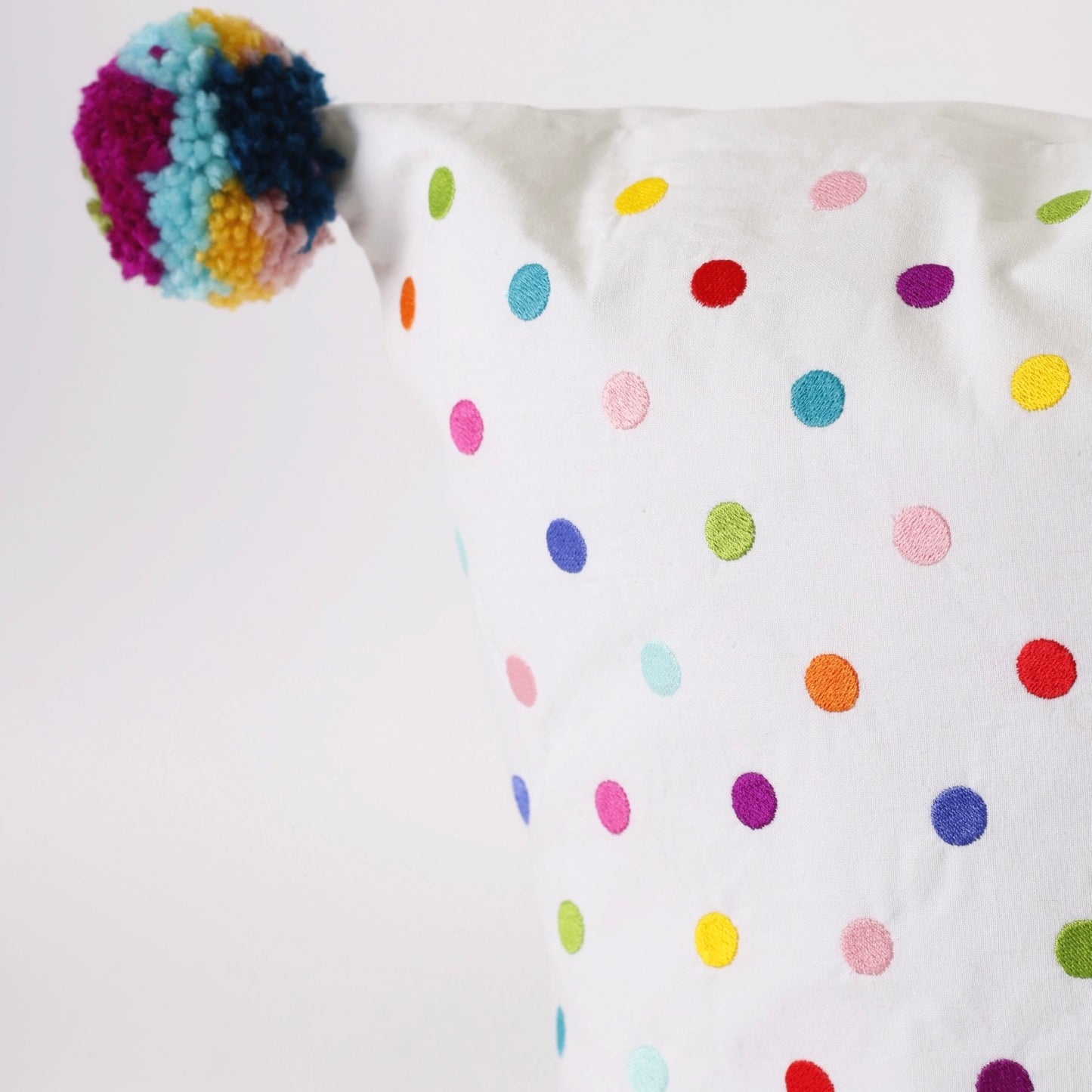 White Embroidered rectangle cotton cushion with pompons