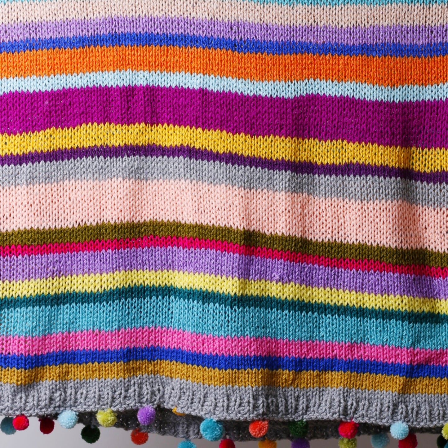 Multicoloured Stripe Knitted Blanket with Pom Poms