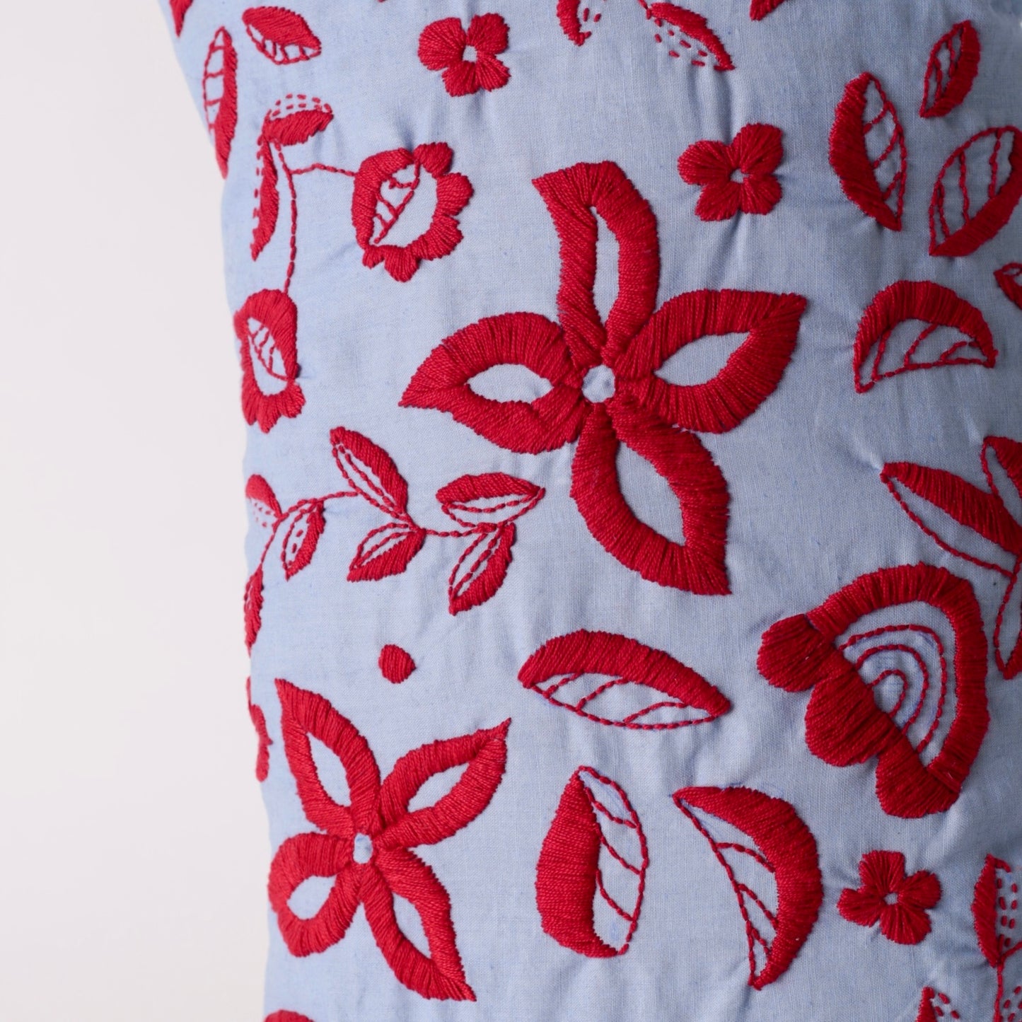 Light blue hand embroidered cushion